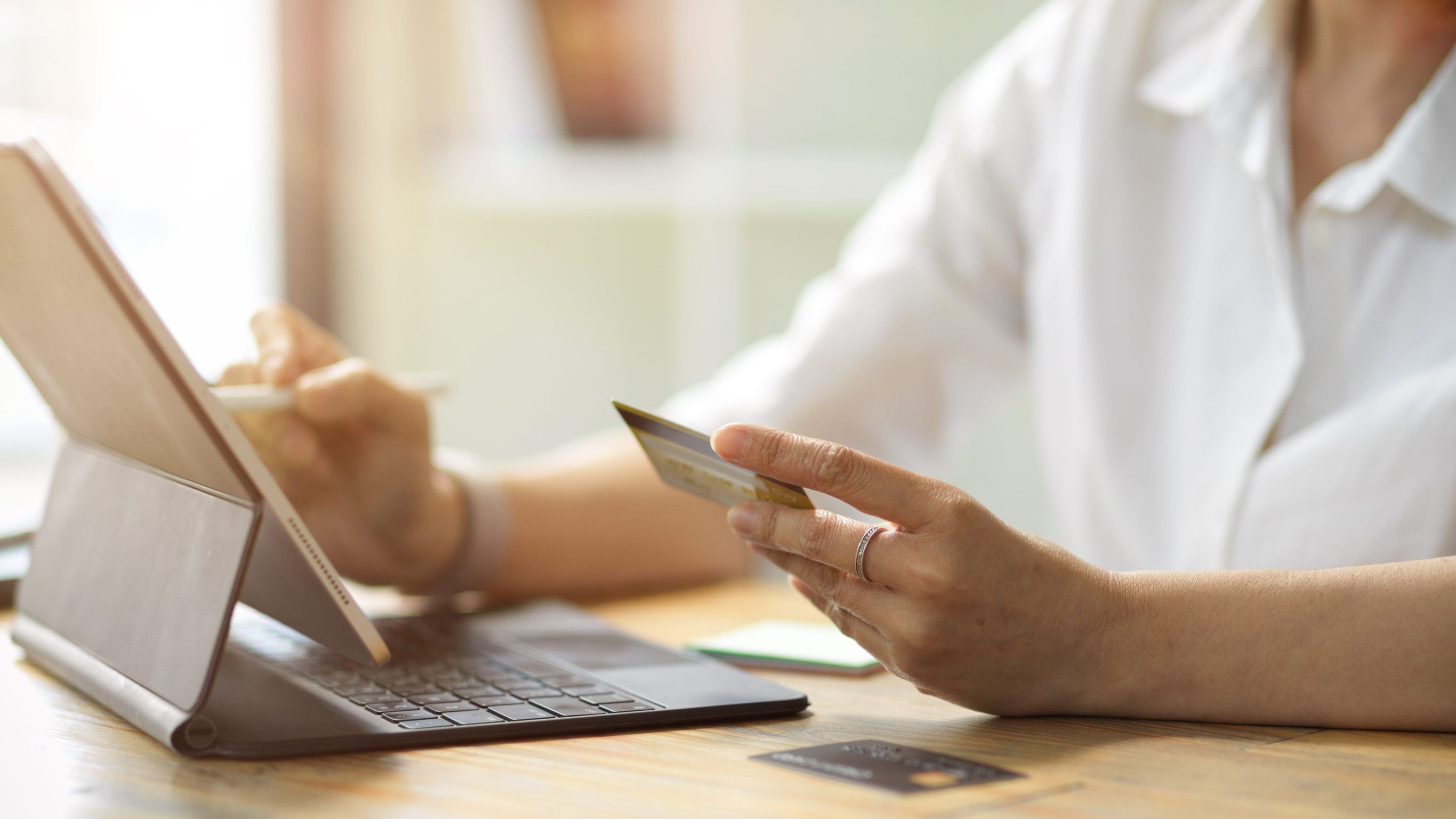 A female paying online through a credit card