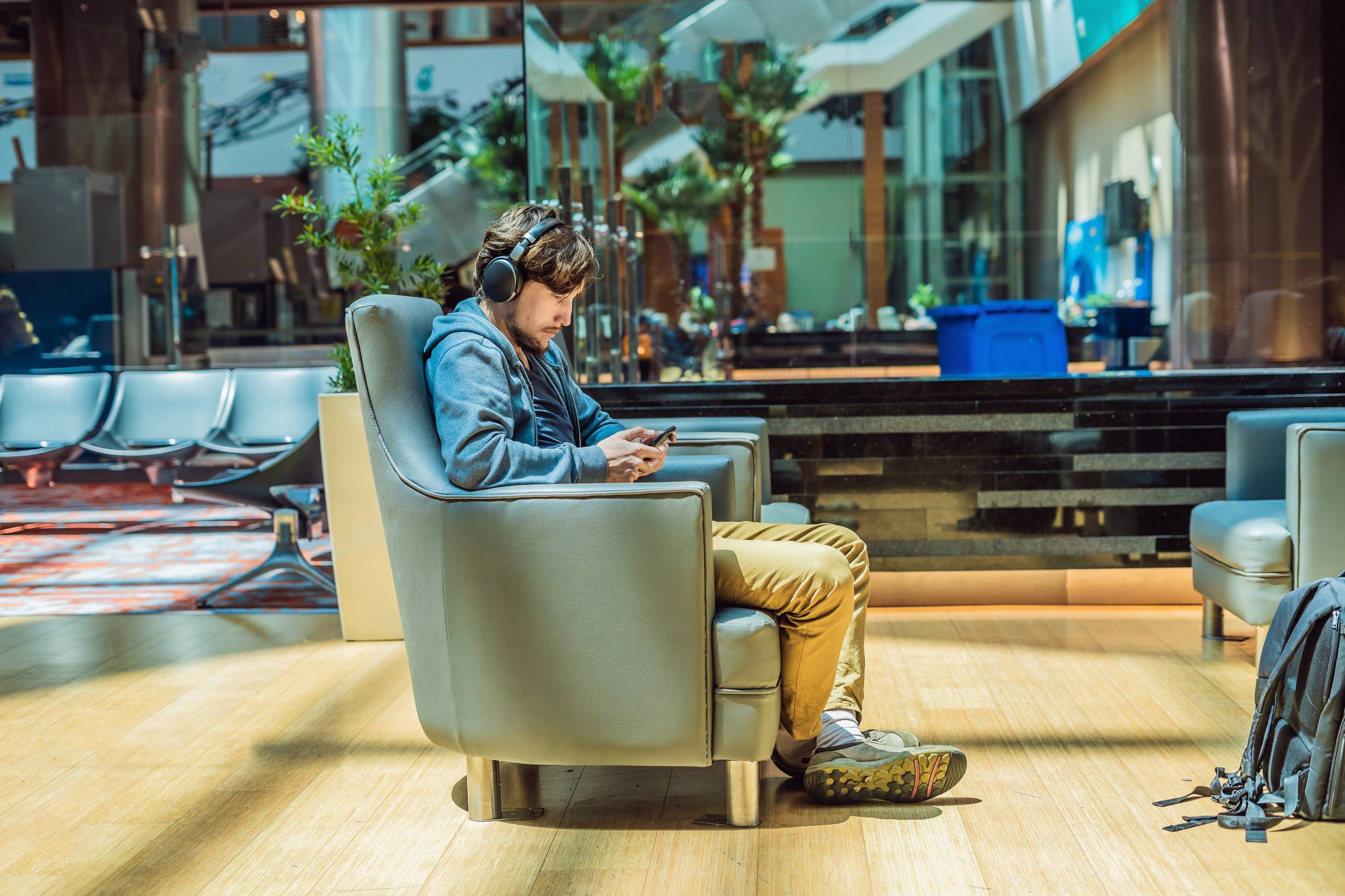 A man sitting at the premium lounge of an airport