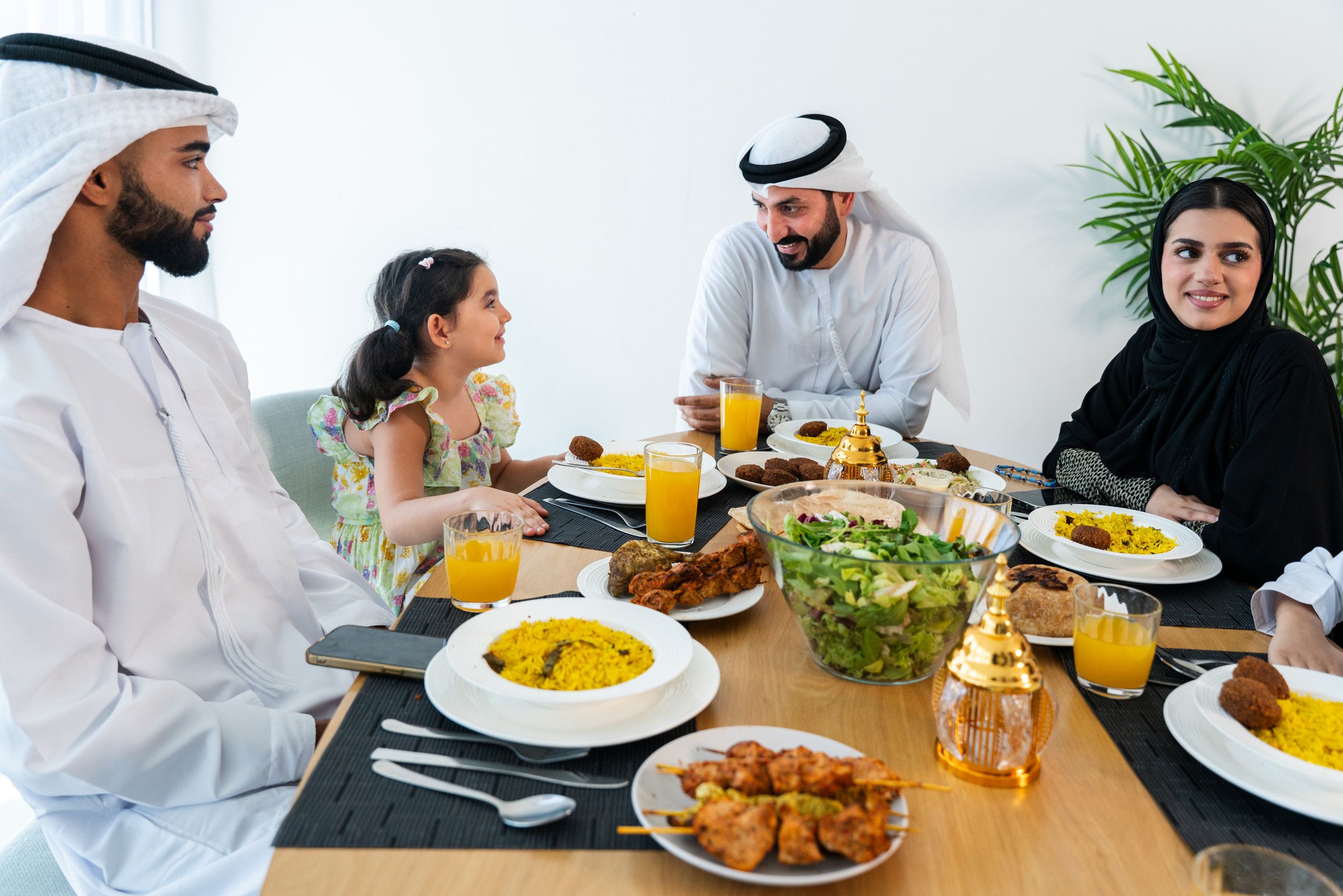 Happy Family Enjoying Dinner After Ramadan In Dubai